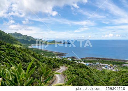 Taiwan Taidong Lanyu scenery: bird's-eye view of Zhonghao Highway under the clouds, traditional underground houses of Yagyin tribes, and Tanlan Bay Taiwan Taidong Lanyu scenery: bird's-eye view of Zhonghao Highway under the clouds, traditional underground houses of Yagyin tribes, and Tanlan Bay 139804318