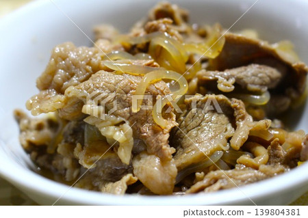 A dish of beef and onions simmered in a sweet and savory sauce. A dish of beef and onions simmered in a sweet and savory sauce. 139804381