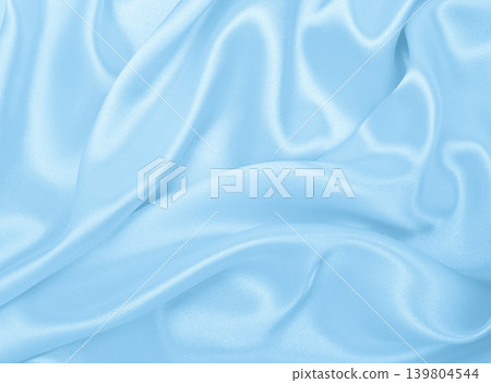 Smooth elegant blue silk or satin luxury cloth texture as abstract background. Luxurious background design Smooth elegant blue silk or satin luxury cloth texture as abstract background. Luxurious background design 139804544