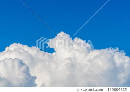 pure white summer cumulonimbus clouds spread across the blue sky. pure white summer cumulonimbus clouds spread across the blue sky. 139804885