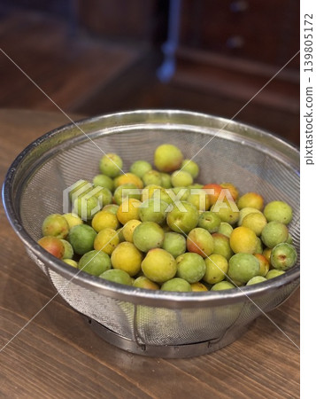 Plum preparation: Plums in a basket Plum preparation: Plums in a basket 139805172