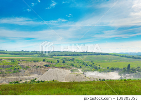 Open Pit Limestone Quarry Mining Site with White Dust Clouds, Industrial Resource Extraction Excavation Area Open Pit Limestone Quarry Mining Site with White Dust Clouds, Industrial Resource Extraction Excavation Area 139805353