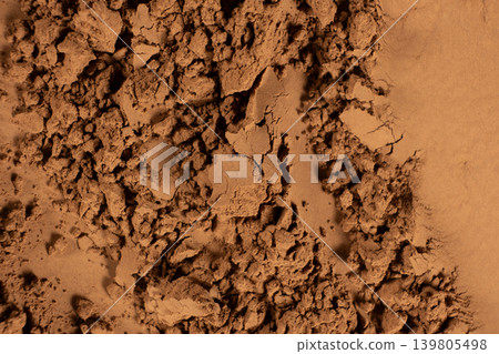 Abstract culinary background with organic cocoa powder waves Abstract culinary background with organic cocoa powder waves 139805498