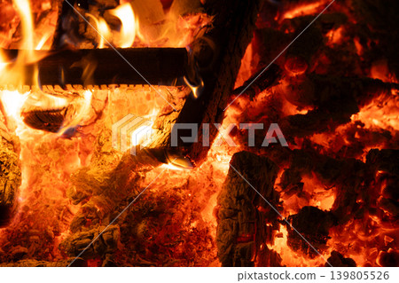 Close-up of Logs Burning with Intense Yellow and Orange Flames. Close-up of Logs Burning with Intense Yellow and Orange Flames. 139805526