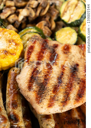 Balanced healthy meal with grilled turkey, sausages and vegetables Balanced healthy meal with grilled turkey, sausages and vegetables 139805544