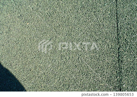 Granular green rubber crumb surface texture close up Granular green rubber crumb surface texture close up 139805653