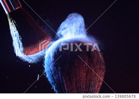 Brush powder explosion forms dense cloud, closeup of plume and tiny particles with red and blue rim lighting editorial test shot capturing dramatic airborne dust, high Brush powder explosion forms dense cloud, closeup of plume and tiny particles with red and blue rim lighting editorial test shot capturing dramatic airborne dust, high 139805678