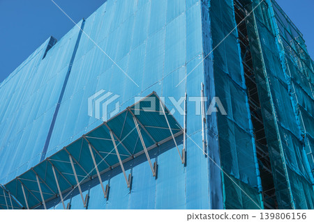 Construction site where falling object prevention components (morning glory) have been installed. Construction site where falling object prevention components (morning glory) have been installed. 139806156