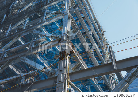 Steel frame construction site with horizontal netting Steel frame construction site with horizontal netting 139806157