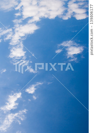 Blue sky filling frame with scattered white clouds, creating a vibrant background for outdoor concepts, weather themes, and atmospheric views on a bright day Blue sky filling frame with scattered white clouds, creating a vibrant background for outdoor concepts, weather themes, and atmospheric views on a bright day 139806177