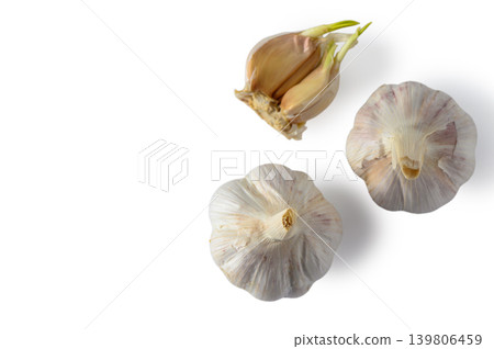 Top View of Two Garlic Bulbs with Cloves Isolated on White Background Top View of Two Garlic Bulbs with Cloves Isolated on White Background 139806459