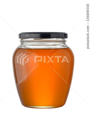 Glass jar with natural transparent golden honey isolated on white background Glass jar with natural transparent golden honey isolated on white background 139806508