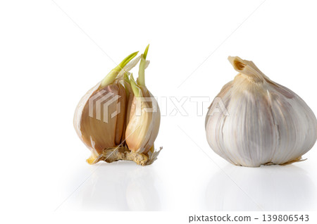 Garlic Bulb with Cloves Isolated on White Background with Copy Space Garlic Bulb with Cloves Isolated on White Background with Copy Space 139806543