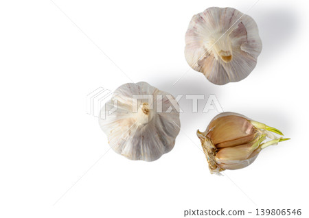 Two Garlic Bulbs with Cloves Top View Isolated on White Background Two Garlic Bulbs with Cloves Top View Isolated on White Background 139806546
