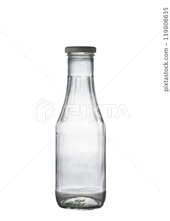 Clear glass bottle for storing various liquid products on white 139806635