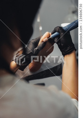 Gloved hands gently hold a delicate tool Gloved hands gently hold a delicate tool 139806730