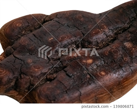 Dark brown piece of old driftwood close-up. Rustic organic abstract texture for natural background. Concept of nature, decay, and unique detail. Dark brown piece of old driftwood close-up. Rustic organic abstract texture for natural background. Concept of nature, decay, and unique detail. 139806871