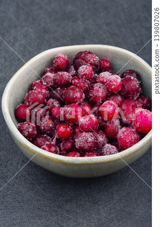 Fresh Frozen Cranberries and Dried Cranberries on Ceramic Plate Fresh Frozen Cranberries and Dried Cranberries on Ceramic Plate 139807026