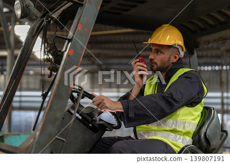 Man worker at forklift driver happy working in industry factory logistic ship. Man worker at forklift driver happy working in industry factory logistic ship. 139807191