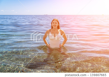 Woman swimming vacation, happy attractive girl enjoying clear water during summer holiday at the seaside. Woman swimming vacation, happy attractive girl enjoying clear water during summer holiday at the seaside. 139807665