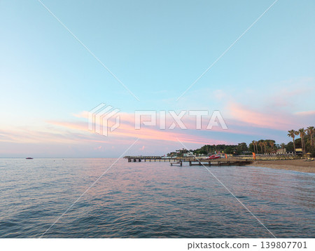 Kemer resort beach with pier at sunset Kemer resort beach with pier at sunset 139807701