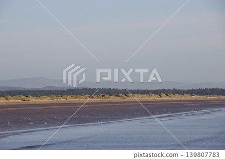 Wide flat sandy beach in Scotland on Fife coast Wide flat sandy beach in Scotland on Fife coast 139807783