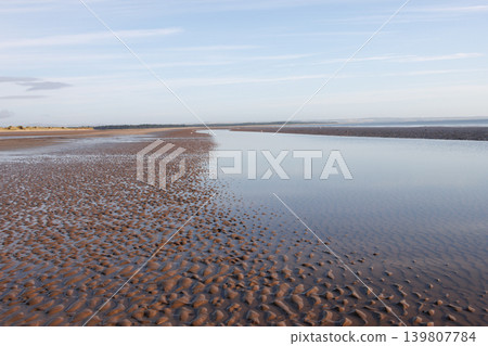Shallow water on ripple sand on West Sands beach at low tide, St Andrews, Scotland Shallow water on ripple sand on West Sands beach at low tide, St Andrews, Scotland 139807784