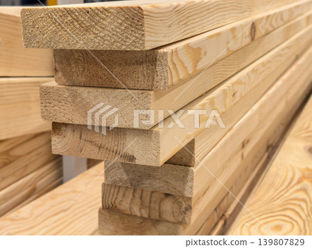 Stacked Pine Wood Planks for Construction and Carpentry Projects Stacked Pine Wood Planks for Construction and Carpentry Projects 139807829