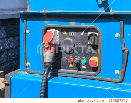 Blue industrial generator control panel with emergency stop button Blue industrial generator control panel with emergency stop button 139807832