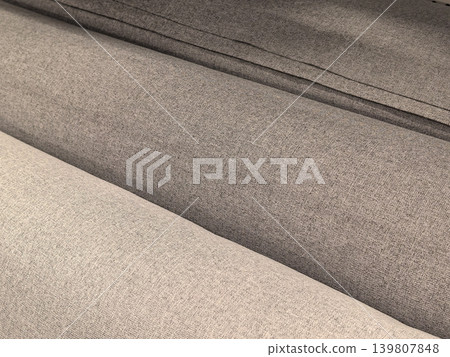 Gray linen sofa fabric texture close up with seat and backrest detail Gray linen sofa fabric texture close up with seat and backrest detail 139807848