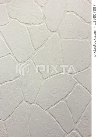 Close-up of bright white plastered uneven stucco wall. Abstract texture, chaotic copy space background. Decorative grunge space. Close-up of bright white plastered uneven stucco wall. Abstract texture, chaotic copy space background. Decorative grunge space. 139807897