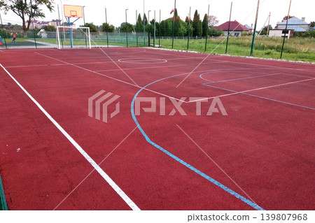 Close-up of white marking lines of outdoor basketball court. Close-up of white marking lines of outdoor basketball court. 139807968