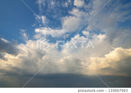 Blue sky covered with white puffy clouds. Blue sky covered with white puffy clouds. 139807983