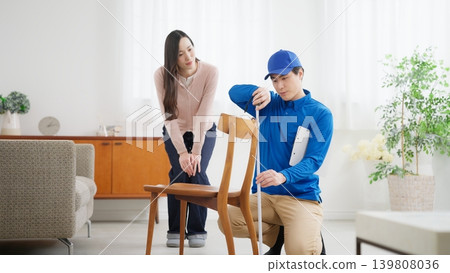 A woman moving and a moving company A woman moving and a moving company 139808036