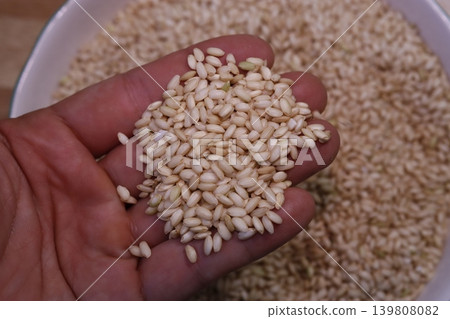 Hand Holding Wheat Grains Close-Up 139808082