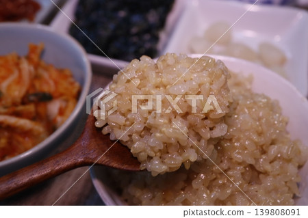 Spoonful of Steamed Rice with Korean Side Dishes Spoonful of Steamed Rice with Korean Side Dishes 139808091