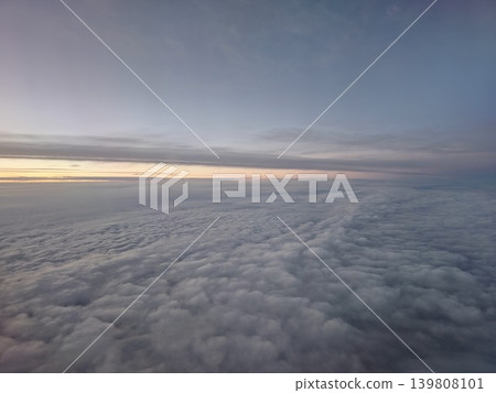 Panoramic aerial cloudscape during sunrise flight above Europe 139808101