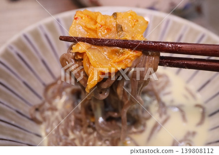 Kimchi Noodles with Chopsticks Close-up Kimchi Noodles with Chopsticks Close-up 139808112
