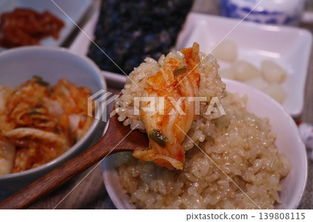 Kimchi Rice with Wooden Spoon and Side Dishes Kimchi Rice with Wooden Spoon and Side Dishes 139808115