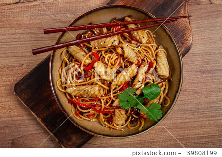 udon noodles, with squid and vegetables, on a wooden table, homemade, no people, udon noodles, with squid and vegetables, on a wooden table, homemade, no people, 139808199