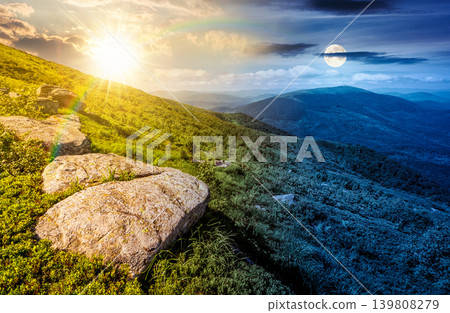 day meet night. carpathian mountain summer solstice landscape. alpine meadow with huge stones among the grass on top of the hillside near the peak of mountain range. epic sky view. harmony concept day meet night. carpathian mountain summer solstice landscape. alpine meadow with huge stones among the grass on top of the hillside near the peak of mountain range. epic sky view. harmony concept 139808279