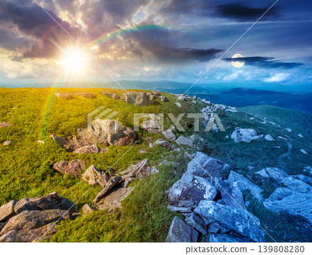 alpine grassy meadow. day meet night. sun and moon over carpathian mountains landscape with boulders. alpine nature scenery of ukraine highlands on summer solstice. view of remote place in mountains alpine grassy meadow. day meet night. sun and moon over carpathian mountains landscape with boulders. alpine nature scenery of ukraine highlands on summer solstice. view of remote place in mountains 139808280