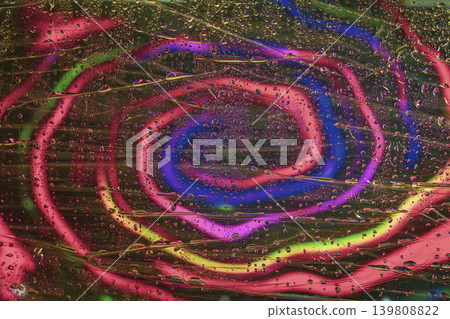 Neon glass background with water drops and circular spiral light lines creating layered texture for digital media, graphic design. Natural background, advertising visuals poster, presentations layout Neon glass background with water drops and circular spiral light lines creating layered texture for digital media, graphic design. Natural background, advertising visuals poster, presentations layout 139808822