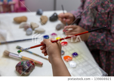 Children Painting Stones With Colorful Paints During Creative Craft Activity. 139808921