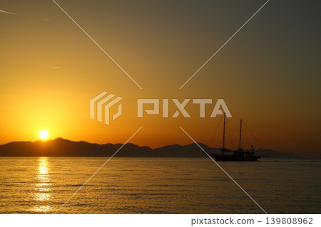 Wooden Gulet returning to the harbor at sunset. Wooden Gulet returning to the harbor at sunset. 139808962