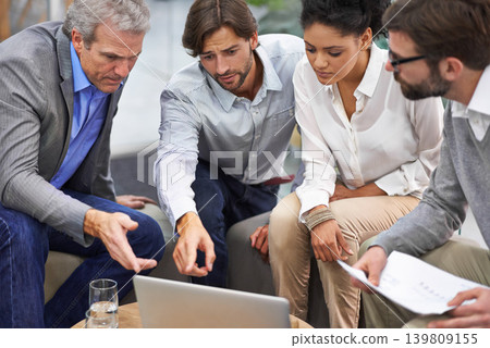 Business people, laptop and meeting with team for planning, strategy or brainstorming at office. Group of employees on computer with documents for discussion, research and development at workplace Business people, laptop and meeting with team for planning, strategy or brainstorming at office. Group of employees on computer with documents for discussion, research and development at workplace 139809155