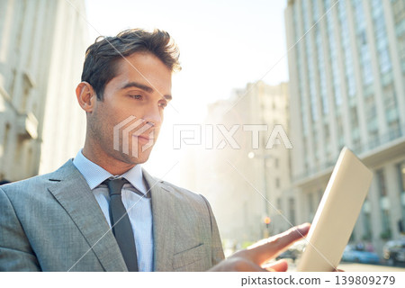 Serious, tablet and businessman in city networking on social media, mobile app or the internet. Career, research and professional male lawyer reading blog on website with digital technology in town. 139809279
