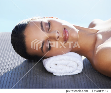 Sleeping, pool or face of woman in spa for wellness, tanning or hospitality in summer for sunshine. Calm peace, relax or zen female person in hotel on holiday vacation for beauty therapy or vitamin d 139809487