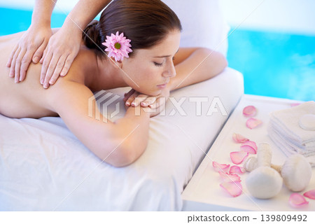 Wellness, massage and woman at spa pool with flower for health, relax and luxury holistic treatment. Self care, peace and girl on table with masseuse for body therapy, sleep and calm hotel service Wellness, massage and woman at spa pool with flower for health, relax and luxury holistic treatment. Self care, peace and girl on table with masseuse for body therapy, sleep and calm hotel service 139809492