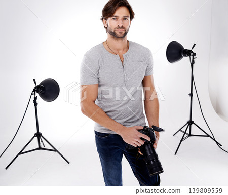 Photographer, confidence or lighting with equipment in studio for career, behind the scenes or camera. Photography, guy and portrait with electronics, flash or shooting gear for photoshoot or passion Photographer, confidence or lighting with equipment in studio for career, behind the scenes or camera. Photography, guy and portrait with electronics, flash or shooting gear for photoshoot or passion 139809559